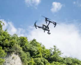 Drone flying to capture video and photos by pro crew